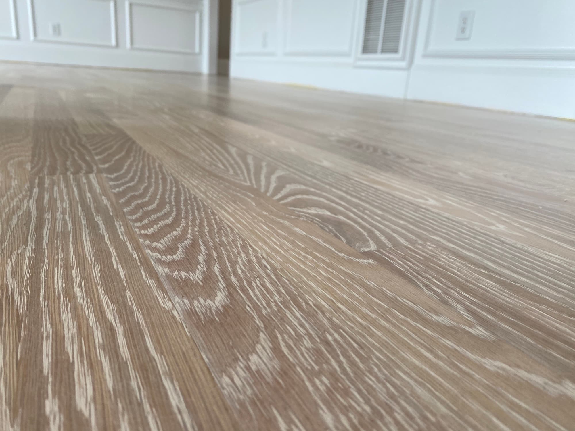 White oak grain revealed after full sanding in Heritage Wake Forest NC, clean bare wood ready for finish
