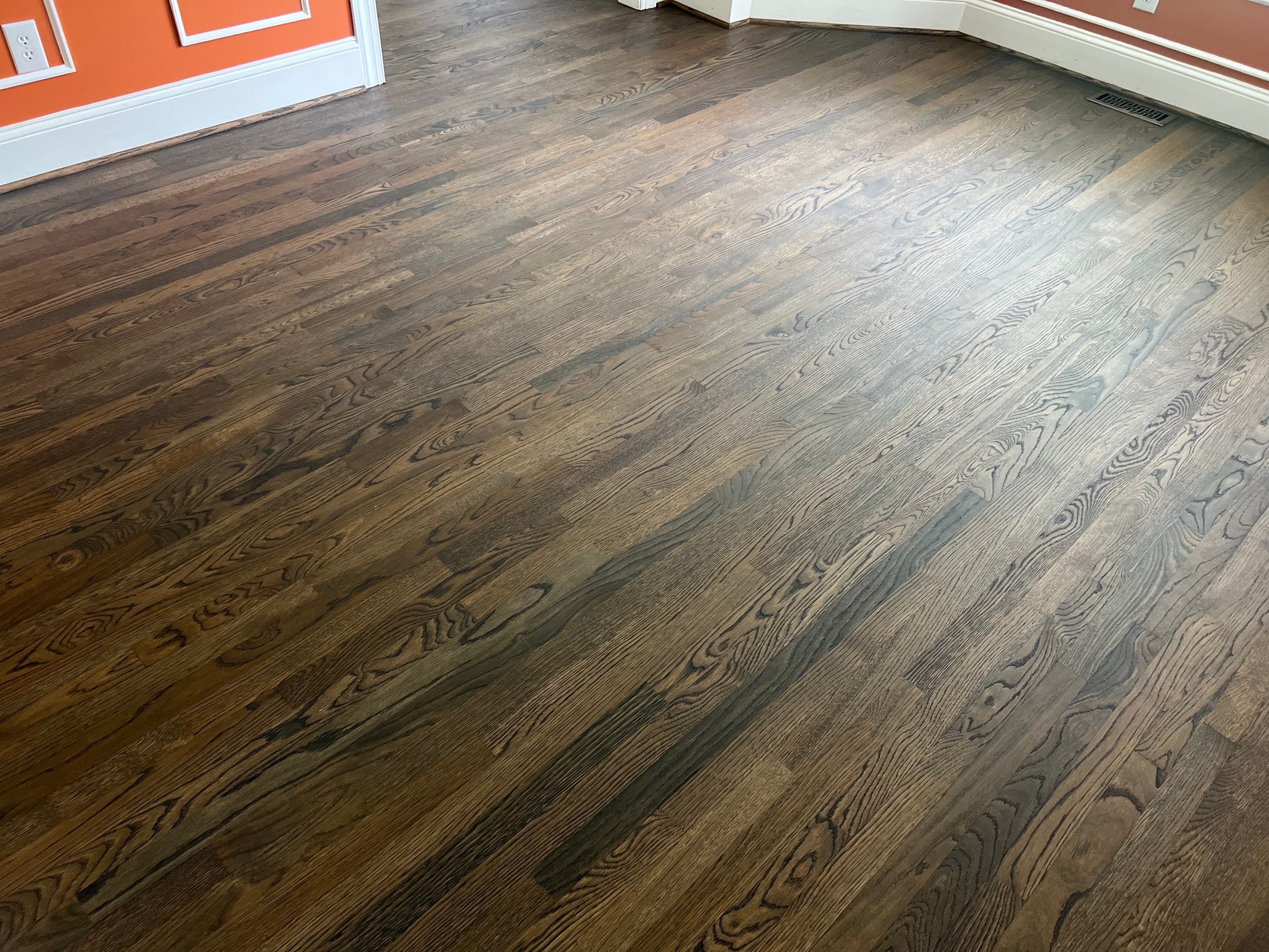 Finished white oak floors with custom blended hardwax oil throughout room in Ole Mill Stream Clayton NC, wide shot showing full field color consistency