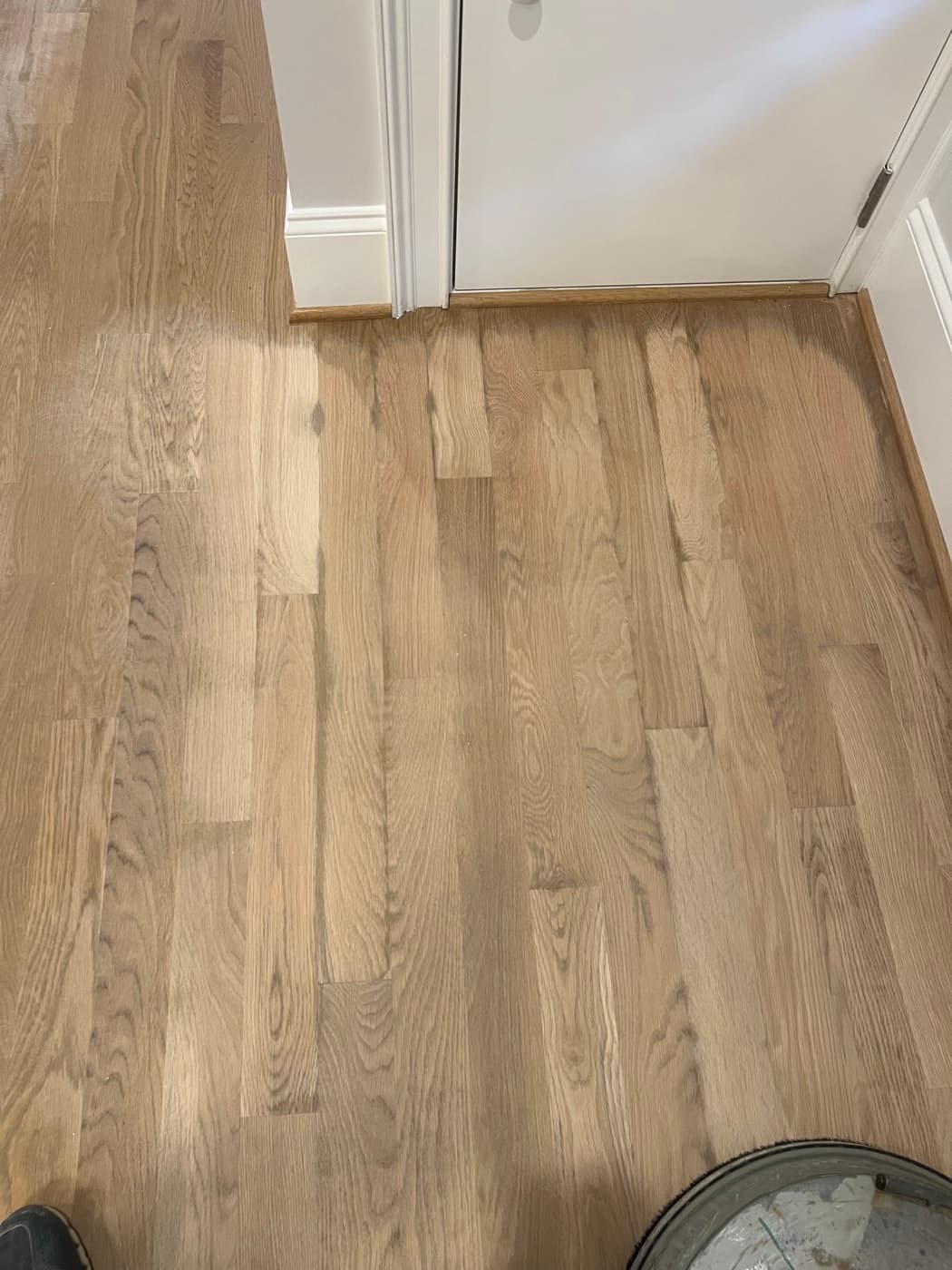 Old water damage discovered on white oak floor during rescue refinishing in Hayes Barton Raleigh NC