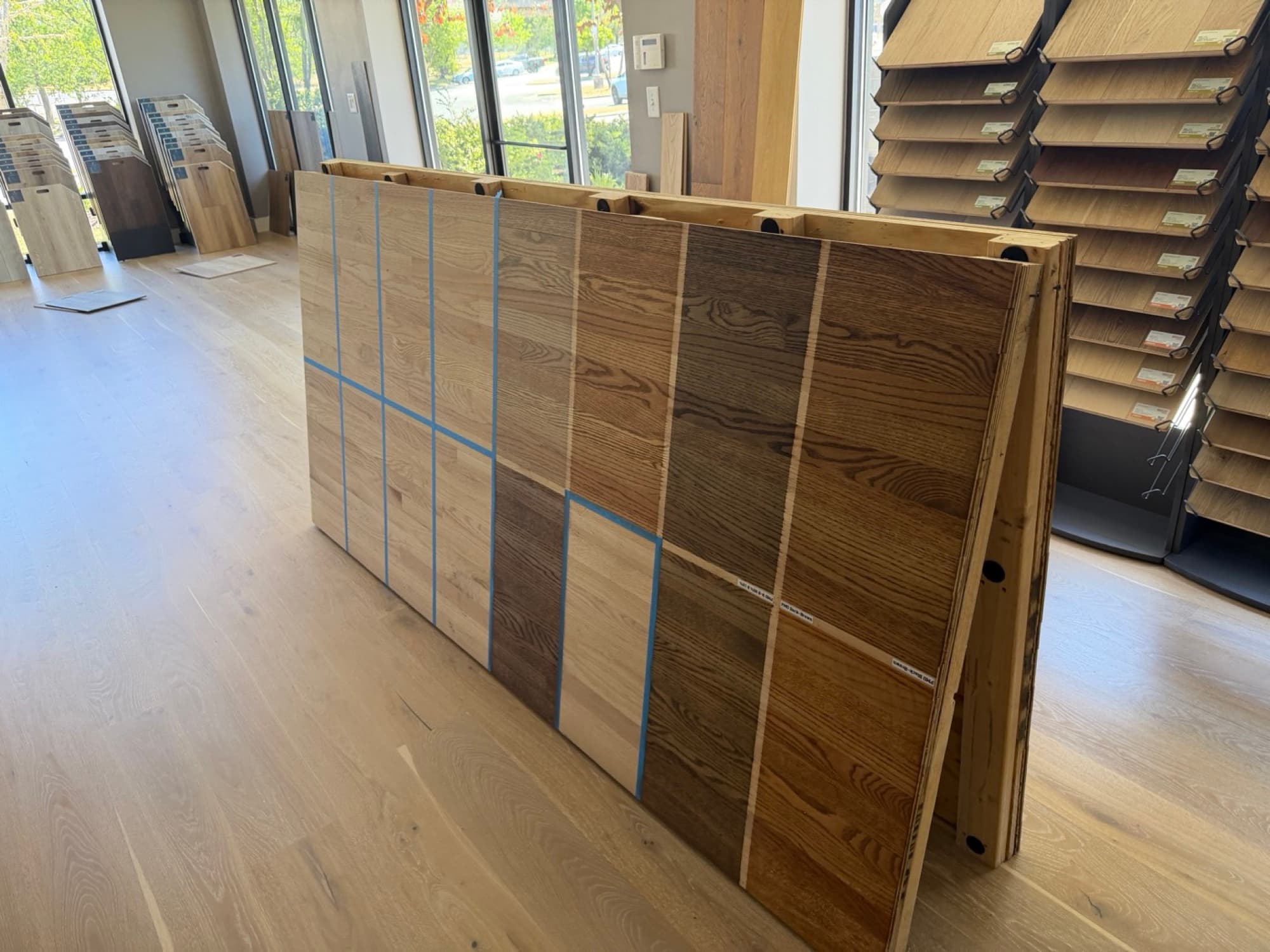 Oak stain comparison boards at 12th And Oak showroom in Clayton NC