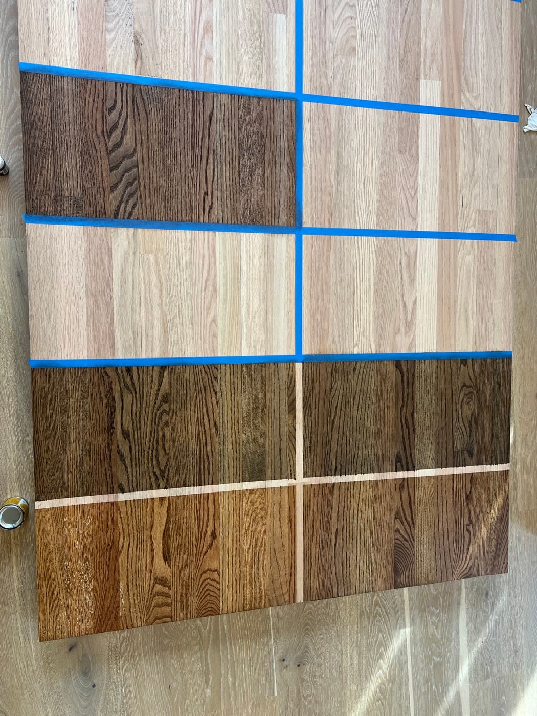 Red oak showroom display panel showing Pallmann Magic Oil hardwax oil colors from natural to dark brown at 12th And Oak Floor Co. in Clayton NC