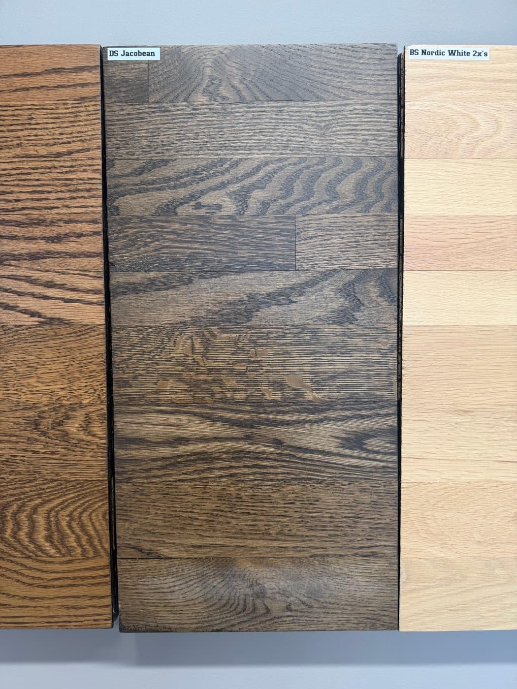 Berger Seidle White Oak natural finish on showroom wall board: top half 2.25 inch red oak, bottom half 3.25 inch white oak
