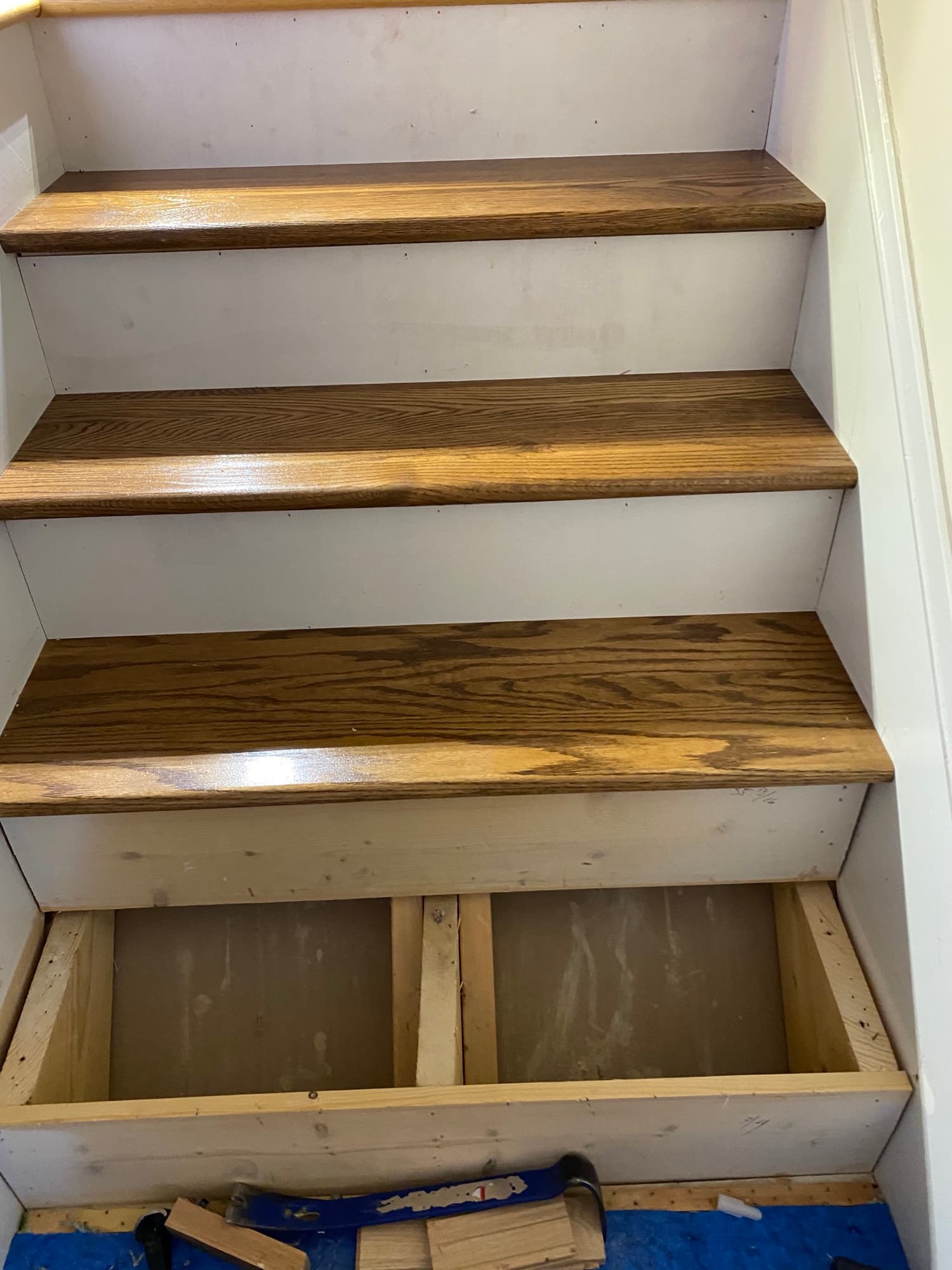 Oak staircase treads and risers installation in progress by 12th And Oak Floor Co. Clayton NC