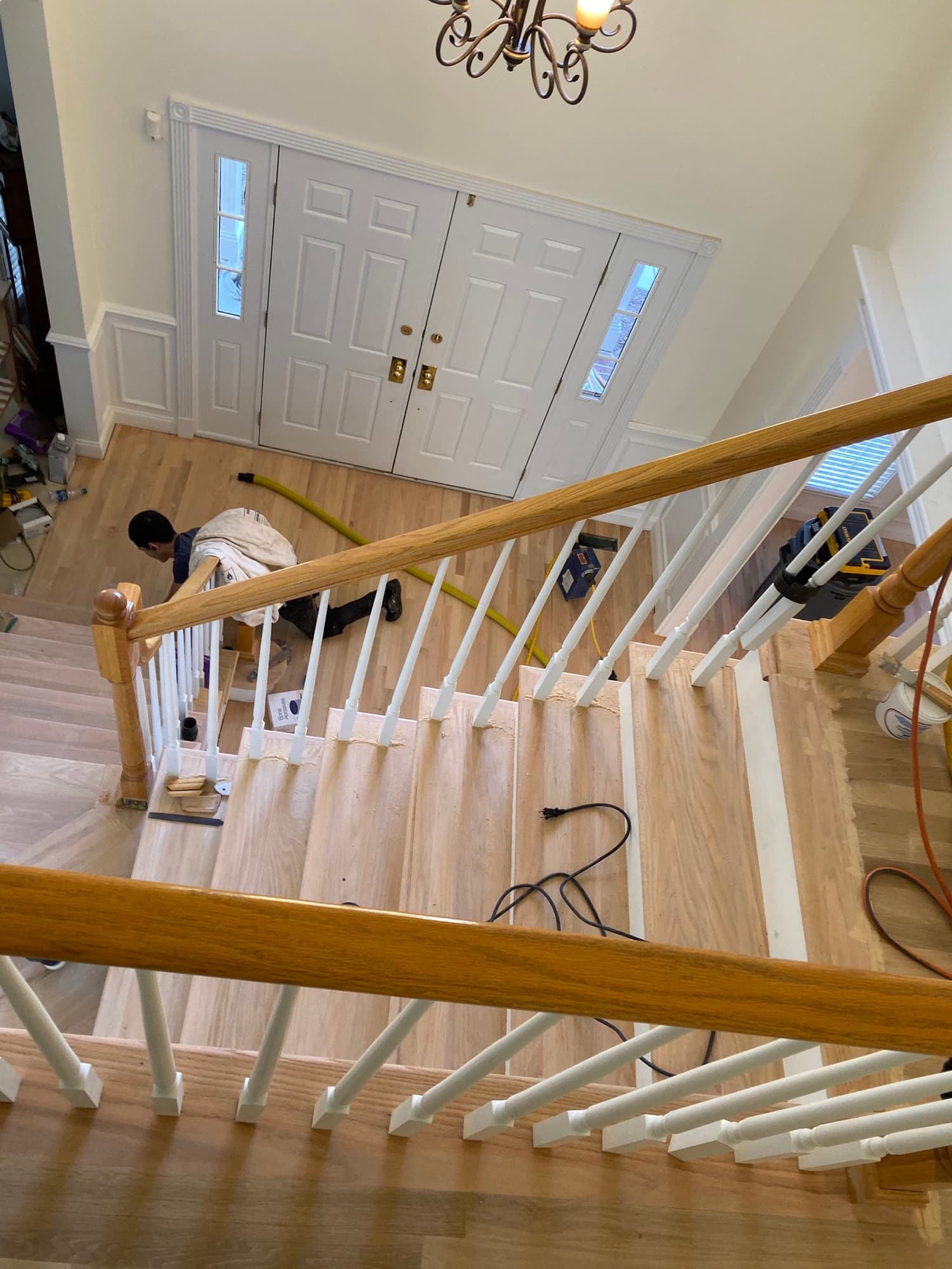 White oak staircase tread installation in progress by 12th And Oak Floor Co. Clayton NC