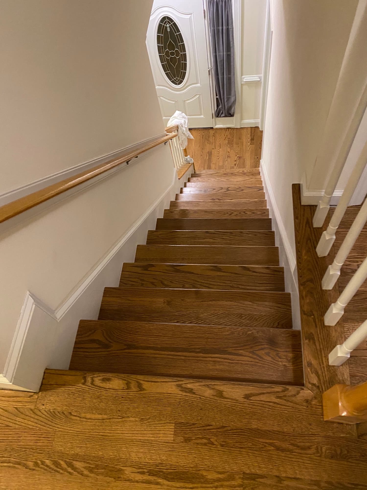 Refinished red oak stair treads after color update and Bona Traffic HD finish in Clayton NC