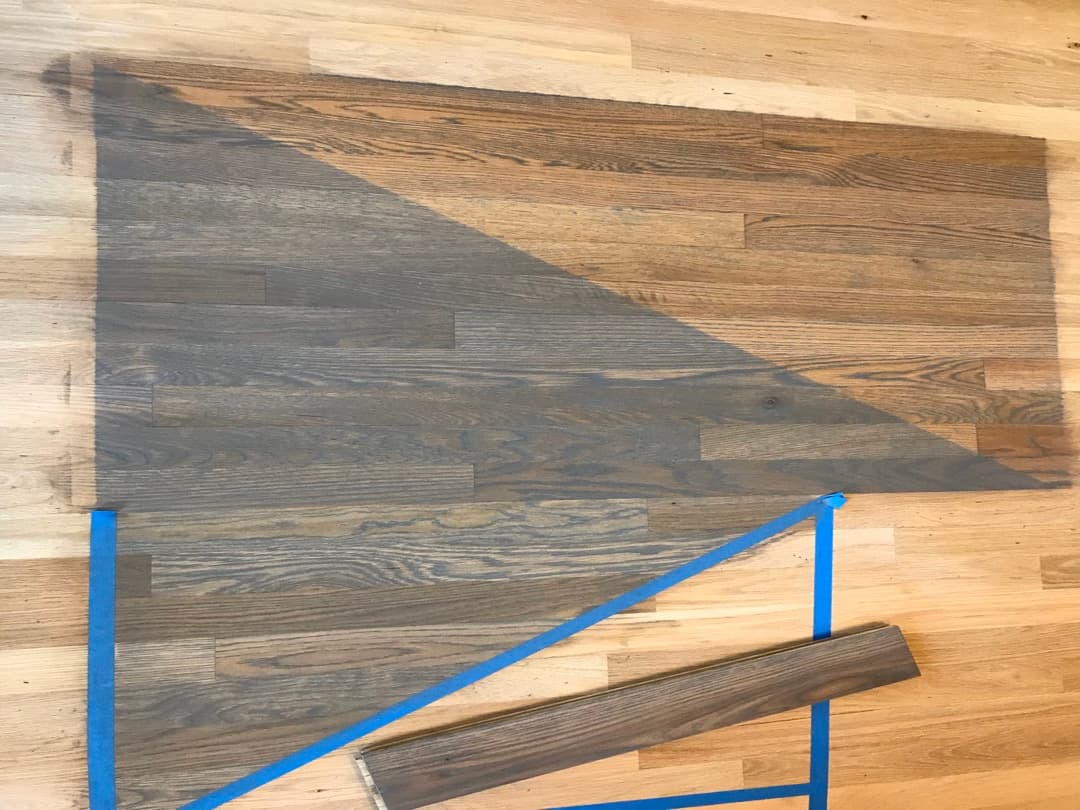Red oak hardwood floor sample showing water popping before and after: upper-right water popped before staining, lower-left stained directly after Bona PowerDrive sanding without water popping