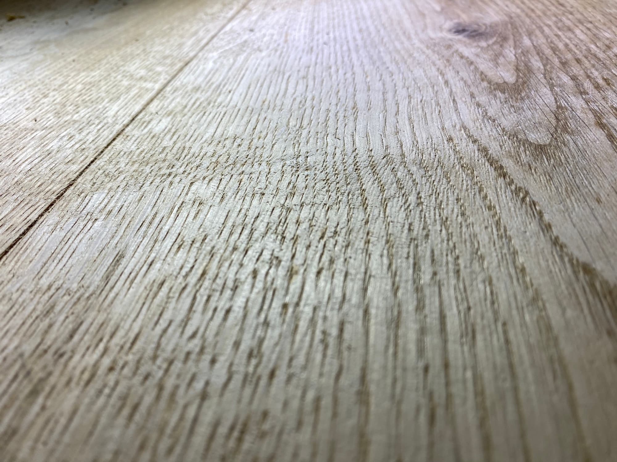 Close up wire brushed texture on wide plank European white oak hardwood floor by 12th And Oak Floor Co. Clayton NC